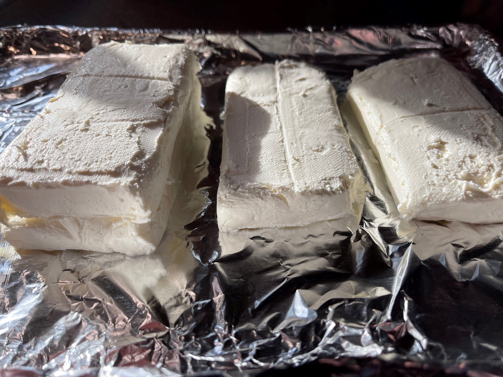Cream cheese blocks cut in half